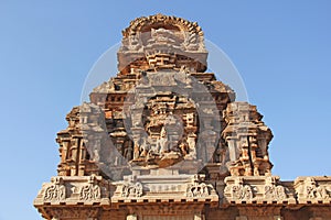 Hazara Rama Temple in Hampi, Karnataka, India. Unesco World Heritage Site. Carving stone ancient background. Fragment of red