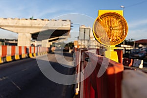 Hazard beacon light at highway construction site for traffic safety