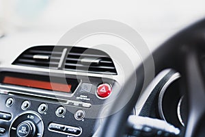 Hazard warning lights button on a car dashboard