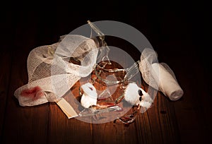 Hazardous debris glass, traces wounds and bandage isolated on black.