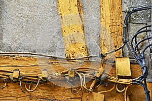 Hazardous, risky electric cabling, wiring outside of an an old house in Rouen, France