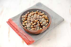 Hazel nuts in clay bowl