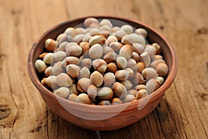 Hazel nuts in clay bowl