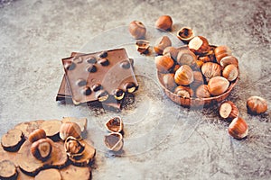 Hazelnut chocolate bar. Nuts and chocolate background. Ingredients for cooking homemade chocolate sweets. Confectionery and sweets