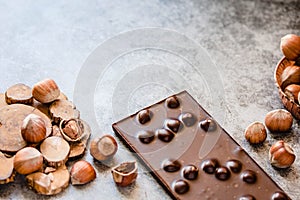 Hazelnut chocolate bar. Nuts and chocolate background. Ingredients for cooking homemade chocolate sweets. Confectionery and sweets