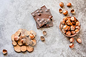 Hazelnut chocolate bar. Nuts and chocolate background. Ingredients for cooking homemade chocolate sweets. Confectionery and sweets