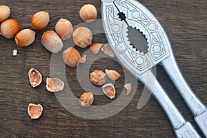 Hazelnut, nutshell and old nutcracker