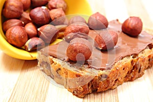 Hazelnut and slices of bread with chocolate cream