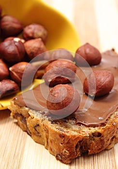 Hazelnut and slices of bread with chocolate cream