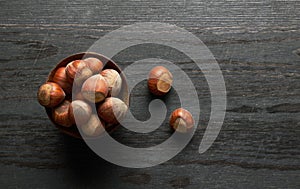 Hazelnut on a wood background