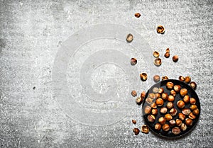 The hazelnuts in an old pan.