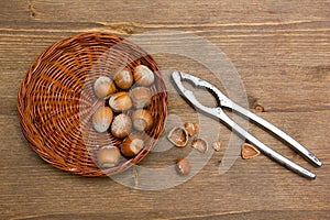 Hazelnuts on wooden nutcracker