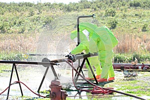 Hazmat team stopping leak