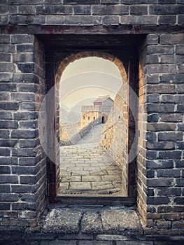 A section of the Great Wall of China at Jinshanling near Beijing, China through tower arch.