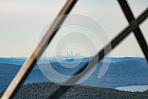 Hazy New York City skyline far in the distance over the Hudson Highlands