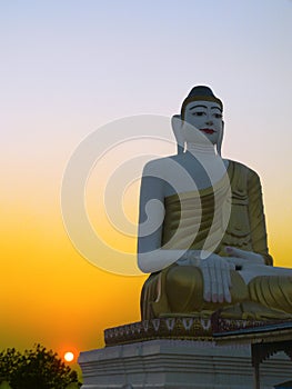 Hazy Sunset by Buddha Statue