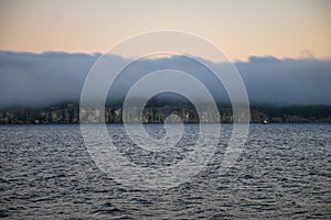 Hazy sunset ocean view overlooking Nanaimo park in British Columbia.