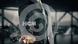 HCM with hologram businessman concept