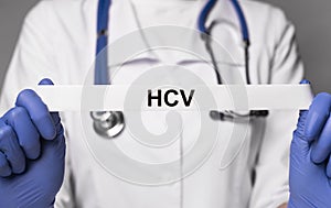 HCV acronym in doctor hand. Medical concept. Blue and white colors