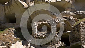 HD fooage. Abanoned houses in rocks. Handheld camera