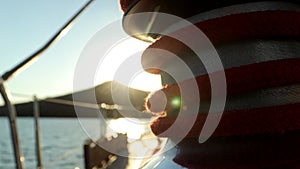 HD Video Of Sun Rays On A Yacht Winch With Red Rope Closeup View