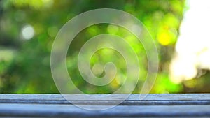 HD Wood floor with blank space and nature green leaf bokeh background