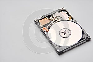 Hdd - hard disk drive. Hard disk repair concept, computer industry. Disassembled hard drive from the computer on white background