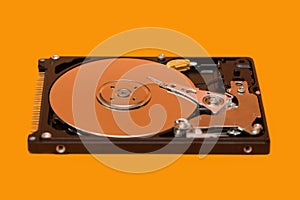 HDD. Open Hard Disk on orange background