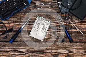 HDD with Precision Screwdriver on Wooden Table