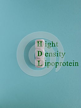 HDL - High-density lipoprotein acronym with marker. Concept words HDL - High-density lipoprotein on beautiful wooden cubes. photo