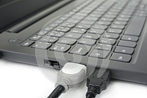 HDMI and USB cable pluged into laptop