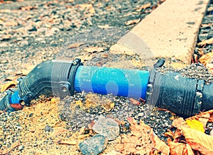 HDPE blue tube connected by bent part to city drinking water supply system