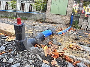 HDPE blue tube connected by bent part to city drinking water supply system