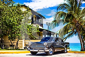 HDR - American black vintage car parked in the front view before the beach in Varadero Cuba - Serie Cuba Reportage