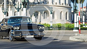 HDR - Black american vintage car drives on the street before the Capitolio in Havana - Serie Cuba Reportage