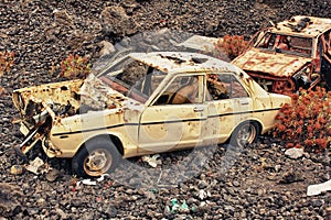 HDR car wreck on lava rock