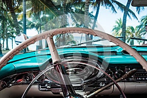 HDR Cuba interior view from a american classic car with view on the beach photo