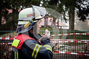 HDR - Firefighter operate with a walkie talkie in action - Serie Firefighter