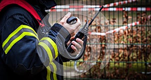 HDR - Firefighter operate with a walkie talkie in action - Serie Firefighter