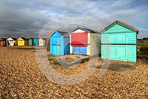 HDR image of colorful beach huts on the south coast of England.