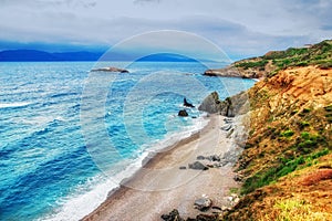 HDR image of a secluded beach on Skiathos island on a cloudy day