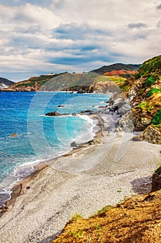 HDR image of a secluded beach on Skiathos island on a cloudy day