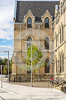 HDR image of summer college unversity campus bikes tree lamp post near entrance