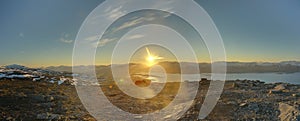 HDR Panorama of midnight sun seen from the peak of Nuolja in Northern Sweden