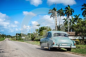 HDR - Parked american green Chevrolet classic car at the side street on the Highway to Havana Cuba - Serie Cuba Reportage