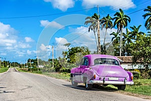 HDR - Parked american green Chevrolet classic car at the side street on the Highway to Havana Cuba - Serie Cuba Reportage.