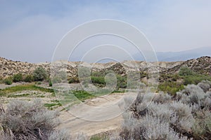 HDR Photo. Desert hills and brush on a smoky, hazy day at Rye Patch State Recreation Area, outside of Lovelock, Nevada
