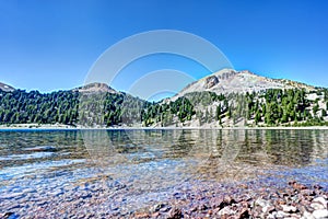 HDR view from the water's edge of Helen Lake in Lassen Volcanic National Park, California.