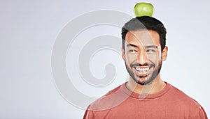 Head balance, thinking or happy man with apple decision for weight loss diet, healthy lifestyle change or nutrition