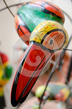 Head of ceramic tukan on a shelf at market in Old Town